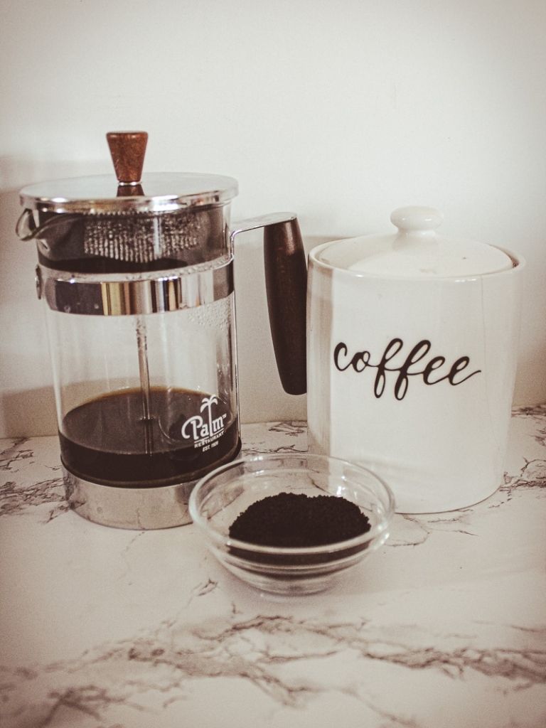 French Press and ground coffee